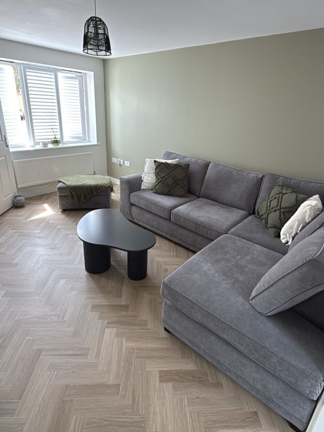beige herringbone luxury vinyl flooring in modern living room